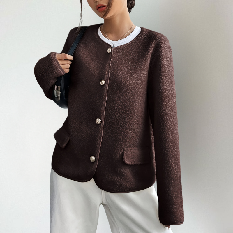 Anouk kraagloos vest met sierknopen en tas, close-up vooraanzicht