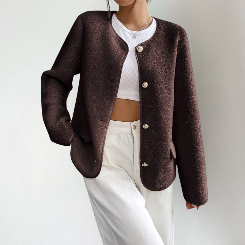 Anouk kraagloos vest close-up detail sierknopen