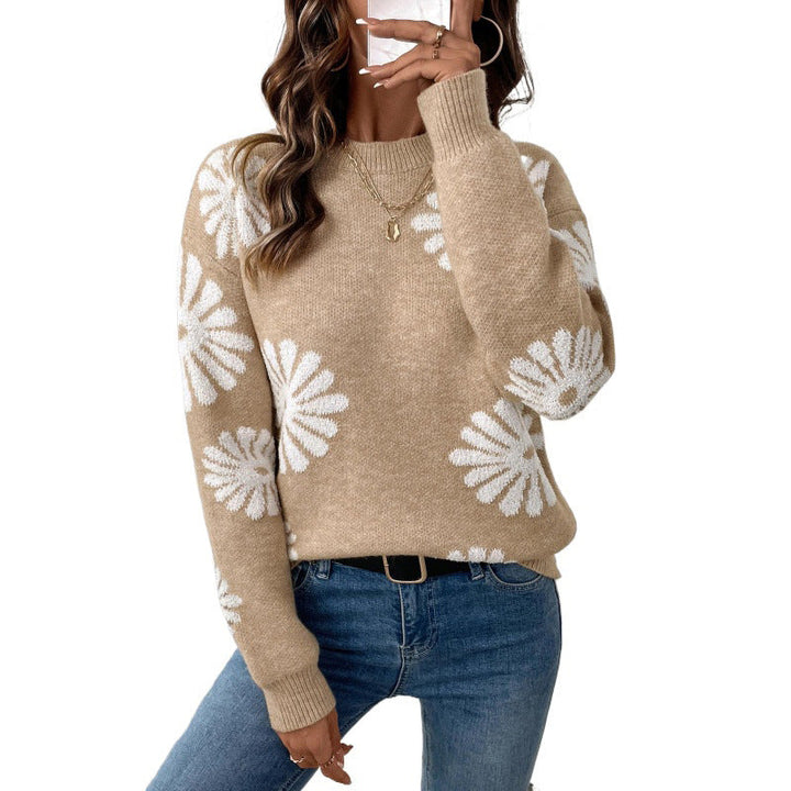 Fleur bloemenprint trui, close-up met telefoon in de hand