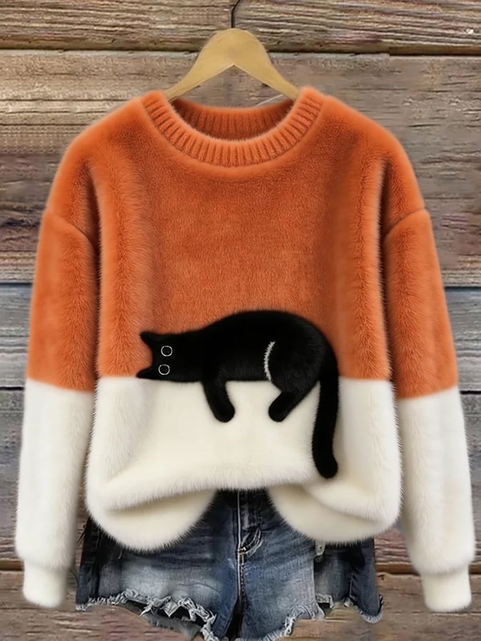Merel colorblock trui met kattenprint in oranje en wit, vooraanzicht