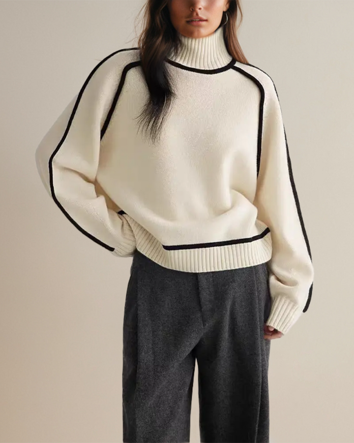 Merel witte colsweater met contrastbies, close-up