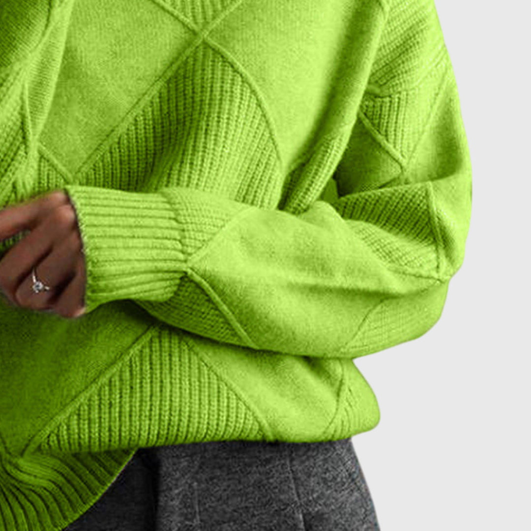 Detail van mouw en manchet in groene coltrui
