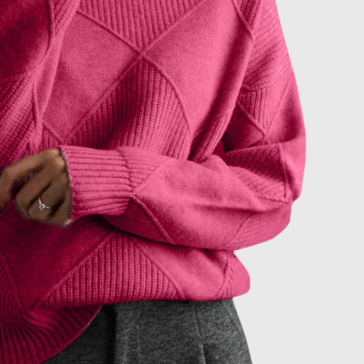Detailfoto van mouw en ribgebreide manchet in roze coltrui