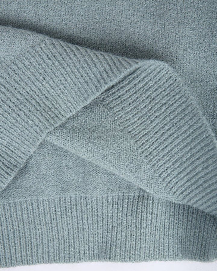 Close-up van geribbelde manchet en zoom van de trui